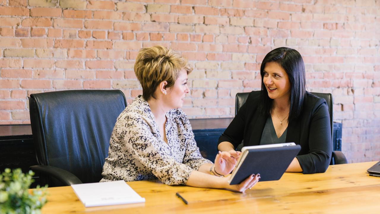 Two women talking in an office
