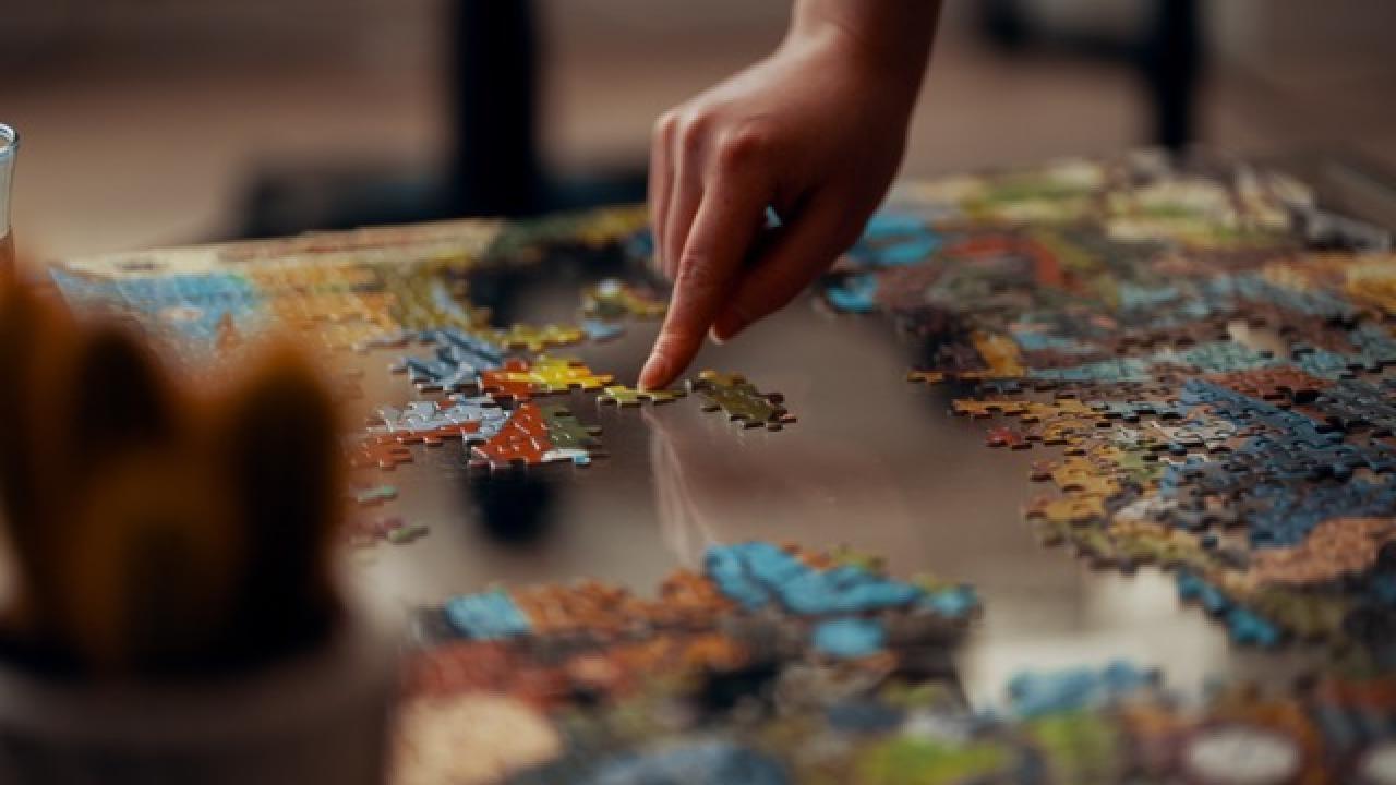 A puzzle and a hand