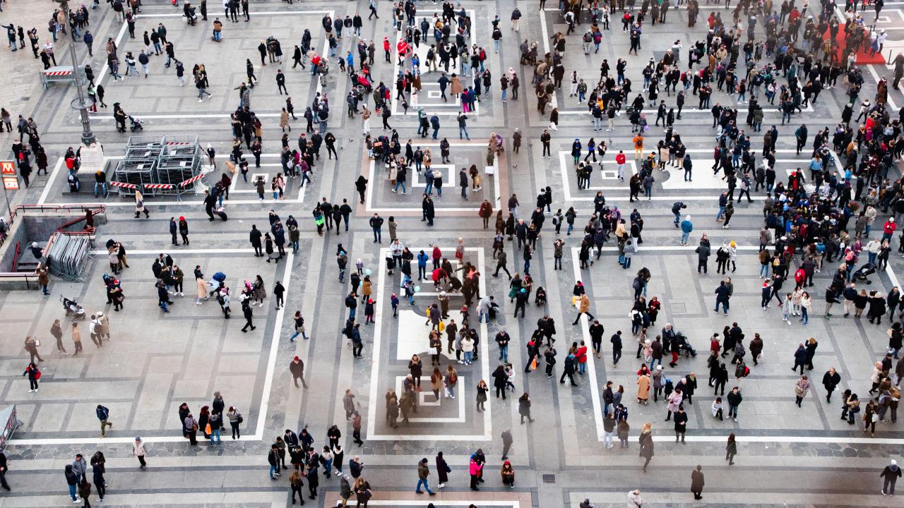 Lots of people walking at a square