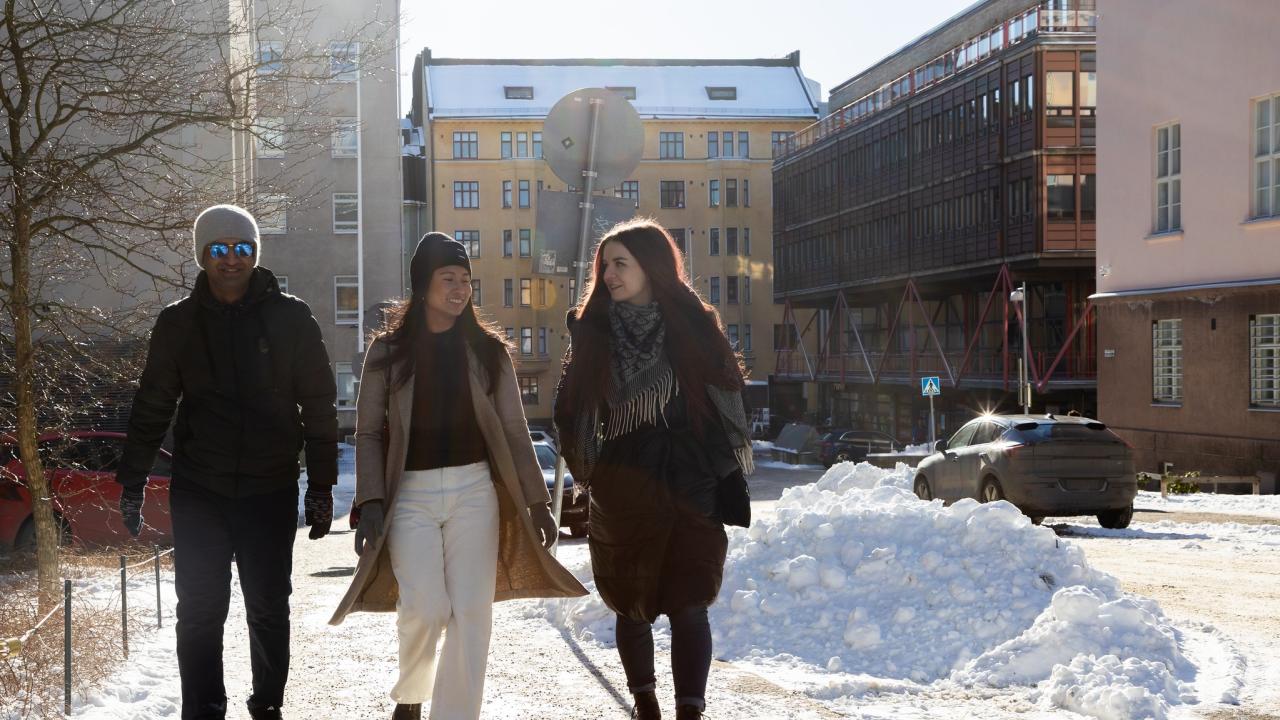 Three Hanken students outside in the winter