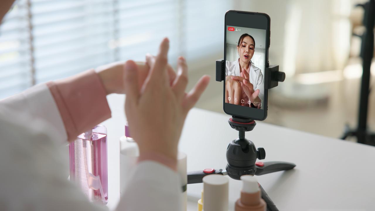 An influencers filming content while testing beauty products.
