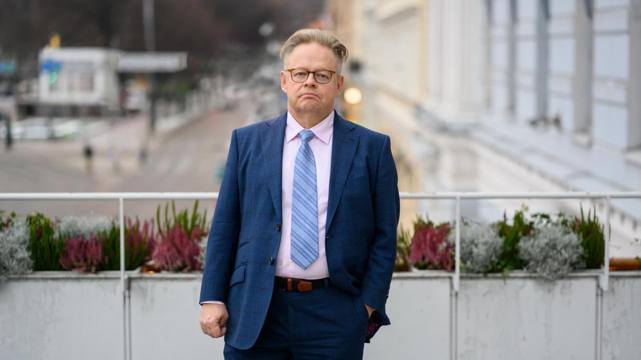 Professor of Practice Juhana Vartiainen standing on a balcony facing the camera.
