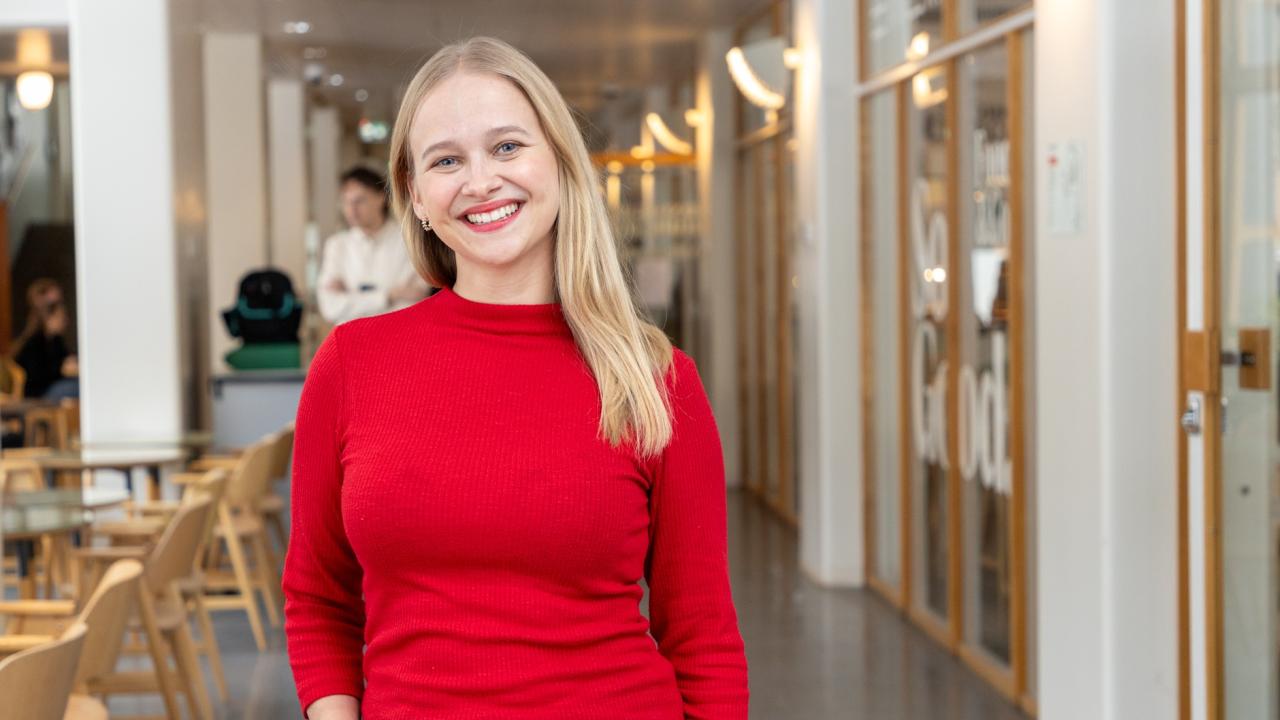 Mirjam Granström, manager for Hanken International Talent, standing in the Hanken corridor