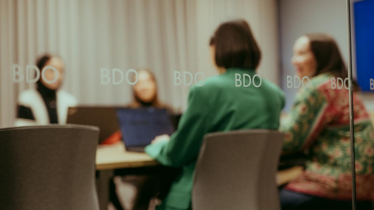 People sitting in a meeting room.