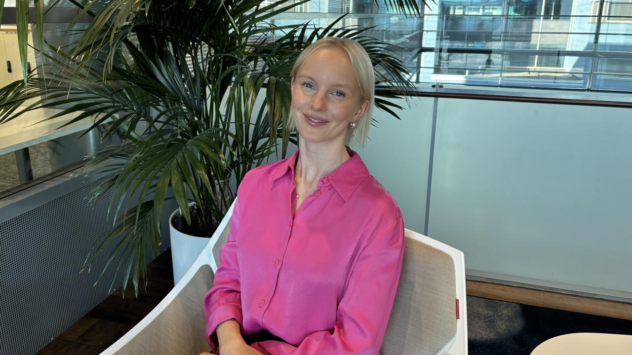 Danske Bank's Bessy Sederlöf sitting on a chair.