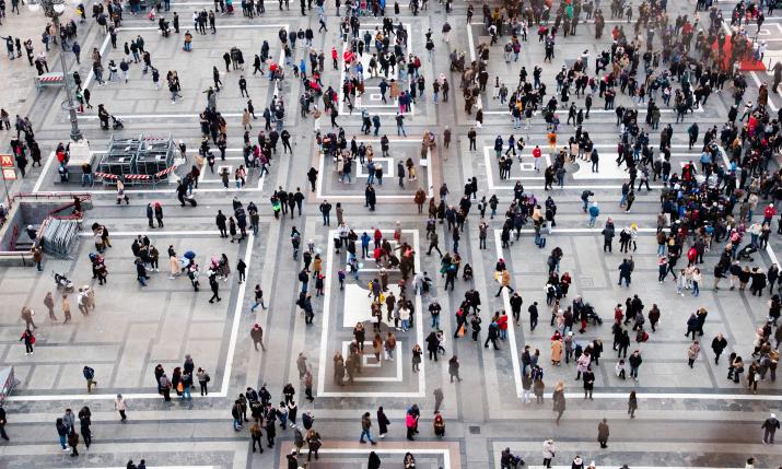 Lots of people walking at a square