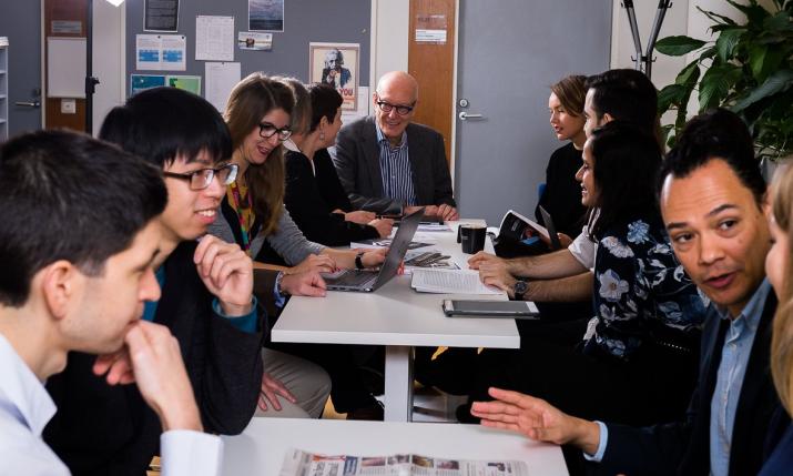 People sitting around a table talking