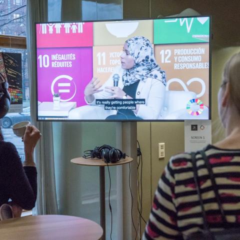 People watching exhibition during SDG week