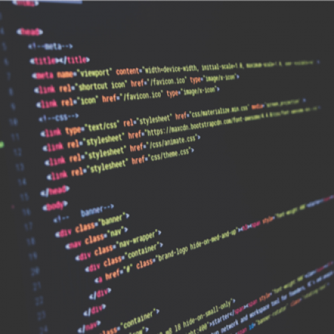 Black computer screen with colourful letters