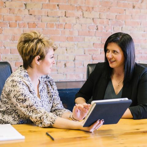 Two women talking in an office