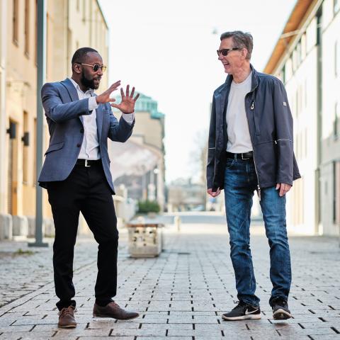 Mikael Still and Silas Mwangi laughing on the street