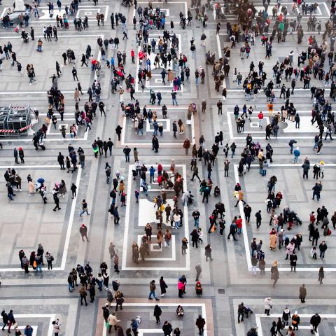 Lots of people walking at a square
