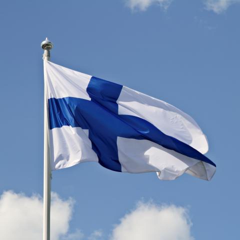 The Finnish flag against the sky